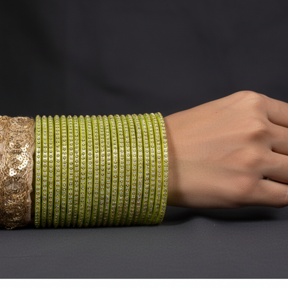 Dhani Green Glass Bangles with Golden Dots & Stone Work – Pack of 36
