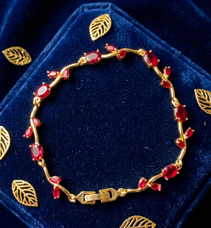 Elegant Gold-Toned Bracelet with Red Stone  Stylish Designer Chain Bracelet for Daily & Party Wear