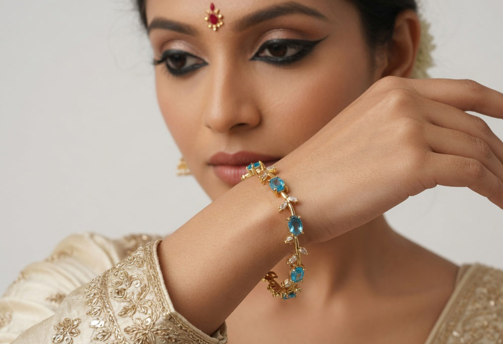 Elegant Gold-Toned Bracelet with SkyBlue Stone Stylish Designer Chain Bracelet for Daily & Party Wear