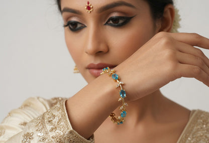 Elegant Gold-Toned Bracelet with SkyBlue Stone Stylish Designer Chain Bracelet for Daily & Party Wear